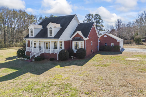 Visit Custom built brick home on 3+ acres
